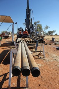 Drill pipe that will be used in the diamond drilling rig in the background, at the Nolans Project, Northern Territory, Australia.